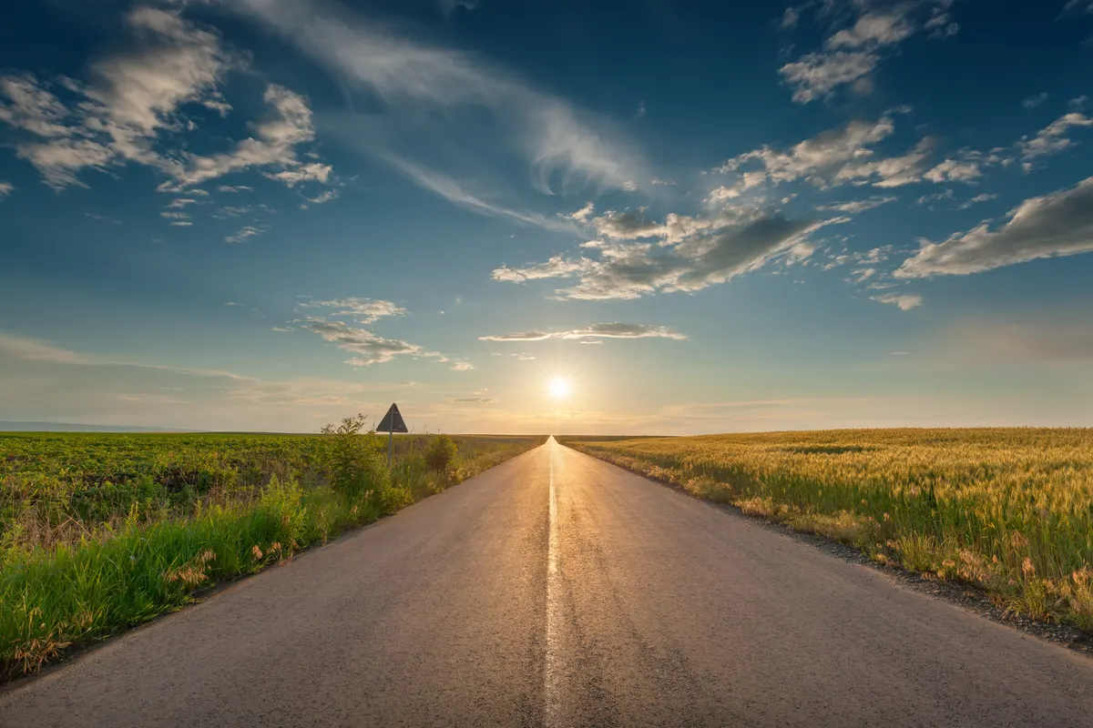 Road between Beauvais and Paris at sunset